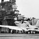 Sailors crowd the rails to watch US Navy test pilot Lieutenant Robert M. Elder operate the modified P-51D Mustang onboard the carrier USS Shangri-La in 1943 (Boeing)